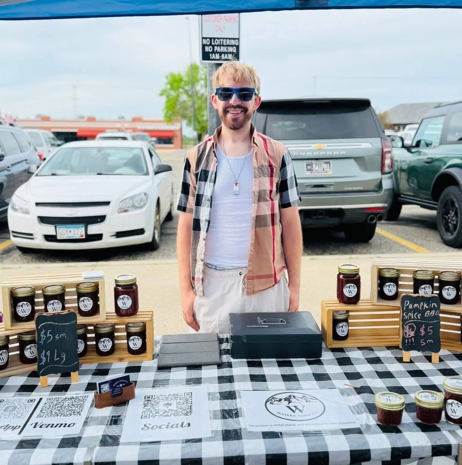 Benjamin at Witikko Sauce Co’s booth at Bemidji’s Natural Choice Farmers Market.